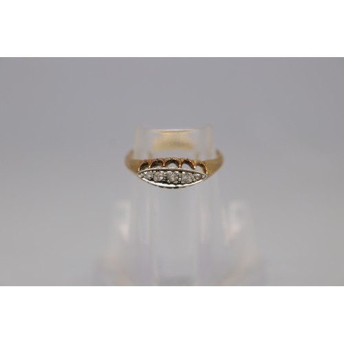 40 - A hallmarked 18ct yellow gold five-stone diamond boat-head ring, set with five graduated round brill... 