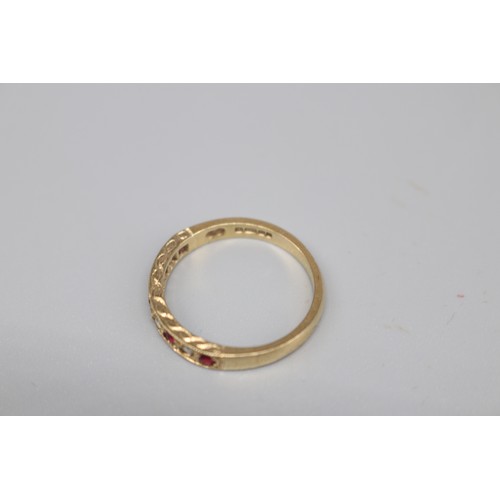 37 - A hallmarked 9ct yellow gold ruby and cubic zirconia pavé-set eternity ring with a millgrain edge. R... 
