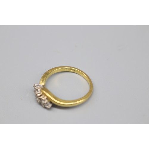 36 - A hallmarked 18ct yellow gold diamond cluster ring, set with seven stones totalling approximately 0.... 