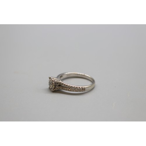 44 - Hallmarked 9ct white gold diamond halo cluster ring, set with a central round brilliant-cut diamond ... 