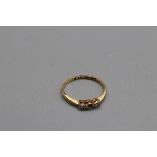 41 - Mixed gold jewellery, comprising a hallmarked 18ct yellow gold diamond trilogy ring, size O, the cen... 