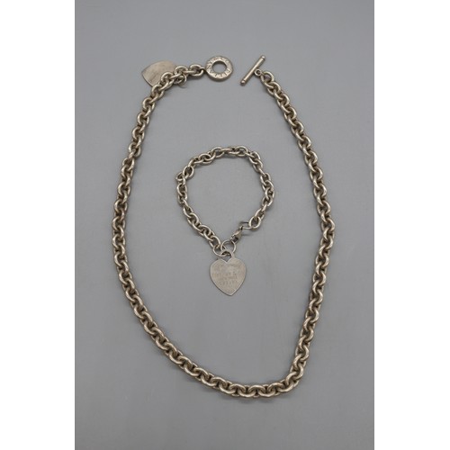 46 - “Return to Tiffany & Co.” sterling silver suite, comprising a 22-inch belcher link necklace with hea... 