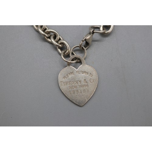 46 - “Return to Tiffany & Co.” sterling silver suite, comprising a 22-inch belcher link necklace with hea... 