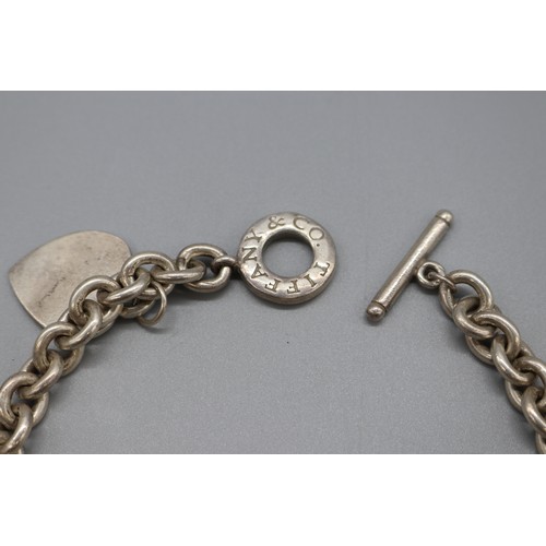 46 - “Return to Tiffany & Co.” sterling silver suite, comprising a 22-inch belcher link necklace with hea... 
