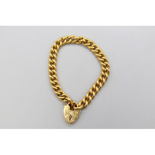 47 - Stamped and tested 9ct yellow gold curb link bracelet with heart-shaped padlock clasp and safety cha... 