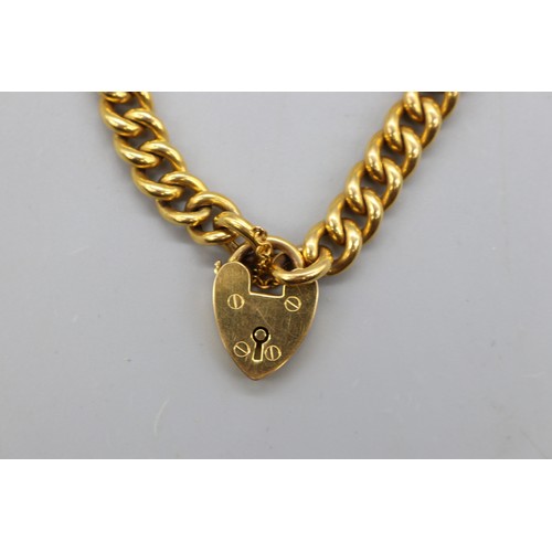 47 - Stamped and tested 9ct yellow gold curb link bracelet with heart-shaped padlock clasp and safety cha... 