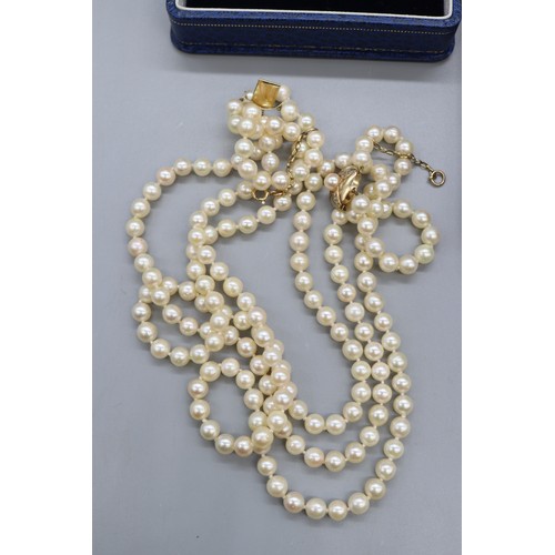 45 - Mixed lot of gold-mounted pearl jewellery, comprising a hallmarked 9ct yellow gold multi-strand pear... 