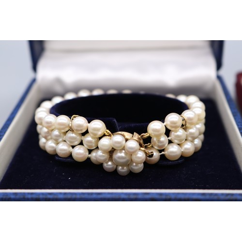 45 - Mixed lot of gold-mounted pearl jewellery, comprising a hallmarked 9ct yellow gold multi-strand pear... 