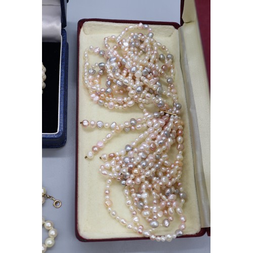 45 - Mixed lot of gold-mounted pearl jewellery, comprising a hallmarked 9ct yellow gold multi-strand pear... 