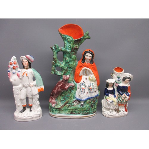 648 - Three Staffordshire ware spill vases; Little Red Riding Hood with Wolf, Gentleman with flowers, and ... 