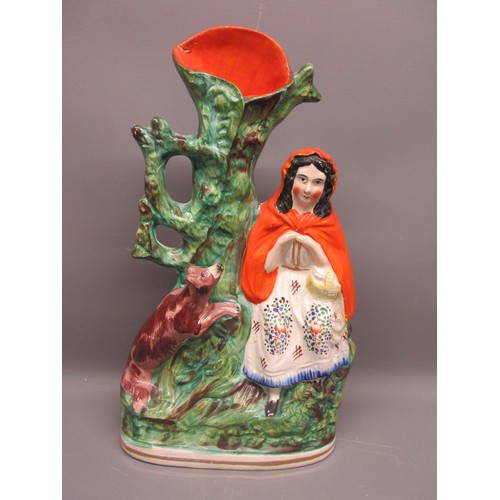 648 - Three Staffordshire ware spill vases; Little Red Riding Hood with Wolf, Gentleman with flowers, and ... 