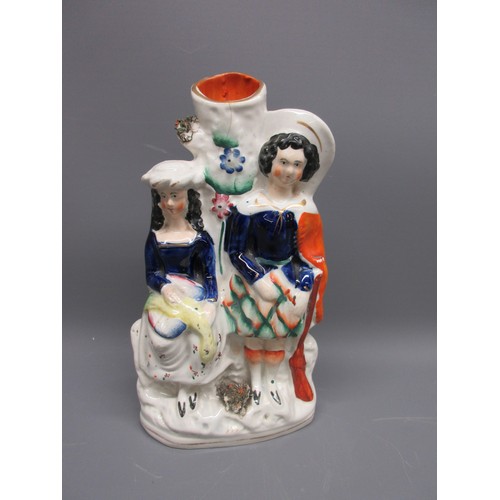 648 - Three Staffordshire ware spill vases; Little Red Riding Hood with Wolf, Gentleman with flowers, and ... 