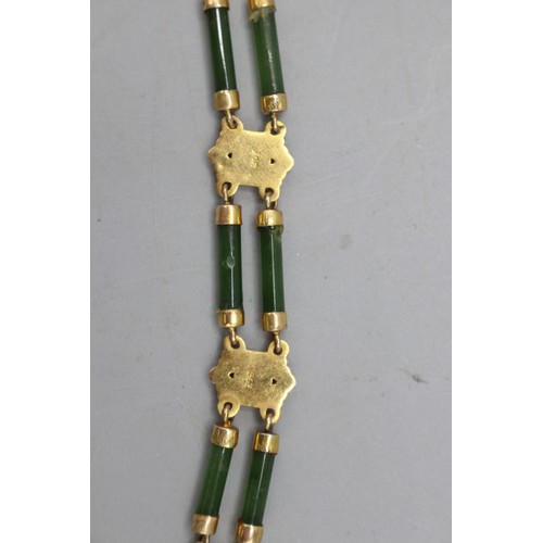 50 - The Janet Ellis Collection - Stamped 9ct yellow gold and jade bracelet, comprising five decorative g... 