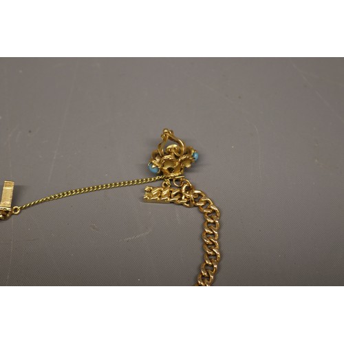 1 - 18ct yellow gold charm bracelet, Eastern stamped and XRF tested, comprising a solid curb link bracel... 