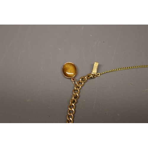 1 - 18ct yellow gold charm bracelet, Eastern stamped and XRF tested, comprising a solid curb link bracel... 