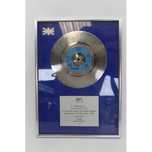 The Carrie & David Grant collection: Original silver disc presented to RSM Music Ltd to recognise sales in the United Kingdom of more than 250,000 copies of the Chrysalis single 'Intuition' (by Linx) 1981. Approx. H36cm W27cm.
Bradleys Shipping £40.00 plus vat (UK Only)
