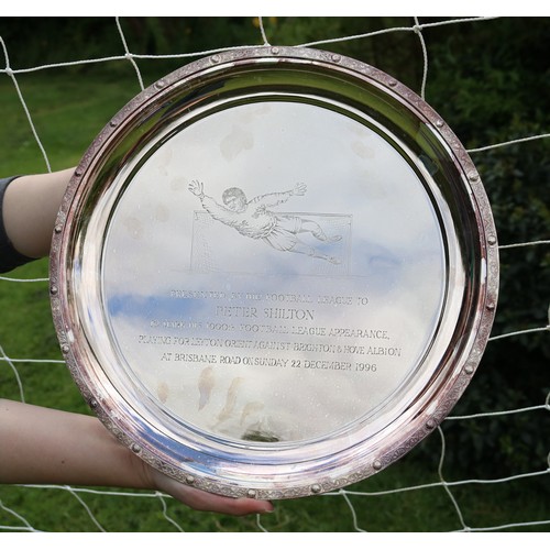 Peter Shilton Collection - Football League presentation silver circular tray with Celtic border, centre engraved 'Presented by The Football League to Peter Shilton TO MARK HIS 1000th FOOTBALL LEAGUE APPEARANCE PLAYING FOR LEYTON ORIENT AGAINST BRIGHTON & HOVE ALBION AT BRISBANE ROAD ON SUNDAY 22 DECEMBER 1990' with breakdown of appearances by club engraved on reverse, D30cm in presentation case