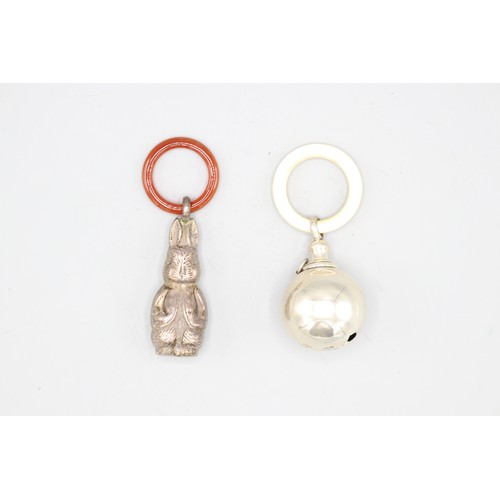 Two silver baby rattles inc. one in Peter Rabbit form with polished ...