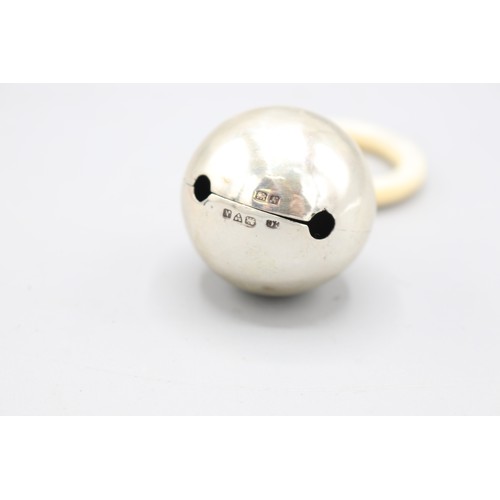 Two silver baby rattles inc. one in Peter Rabbit form with polished ...