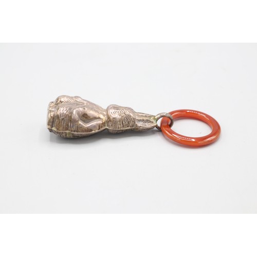 Two silver baby rattles inc. one in Peter Rabbit form with polished ...