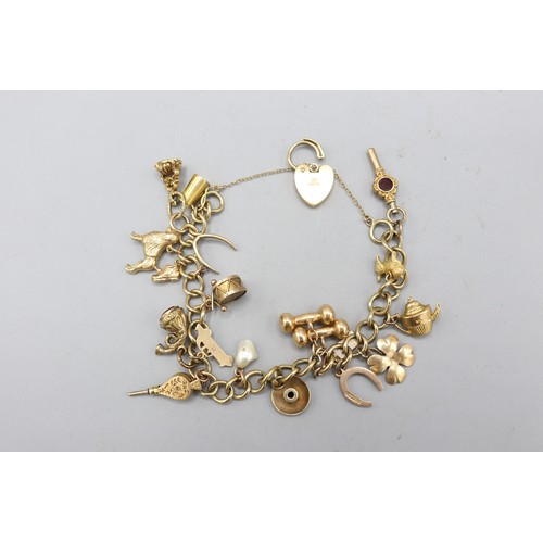 Hallmarked 9ct yellow gold curb link charm bracelet with engraved heart-shaped padlock clasp and safety chain, suspending eighteen assorted charms of various styles, including bloodstone bellows, a carnelian fob, French horn and other examples. Total weight 38.36g
Bradleys Shipping £25.00 + VAT (UK only)