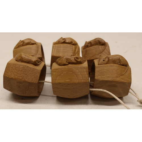  Robert Mouseman Thompson of Kilburn - a set of six oak octagonal napkin rings, carved with signature... 