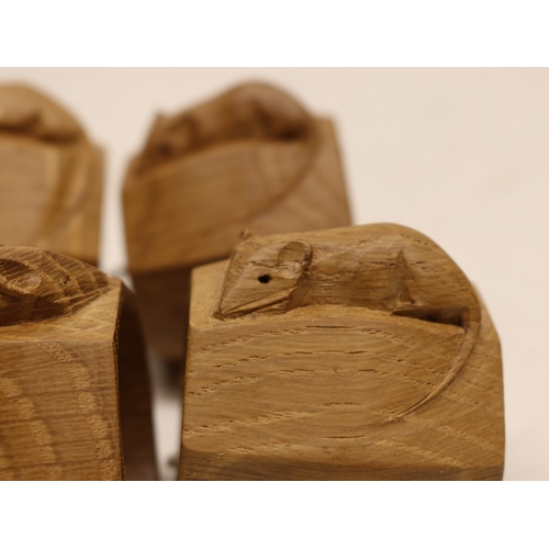  Robert Mouseman Thompson of Kilburn - a set of six oak octagonal napkin rings, carved with signature... 