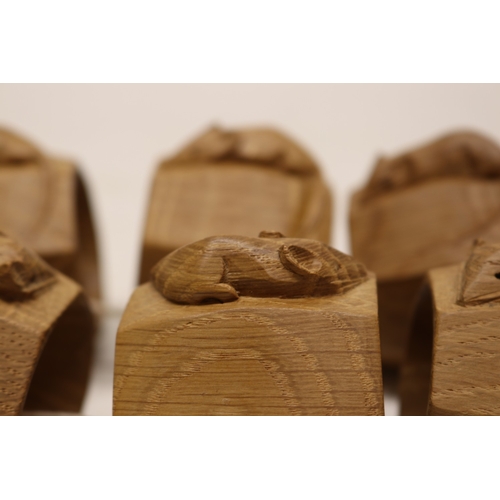  Robert Mouseman Thompson of Kilburn - a set of six oak octagonal napkin rings, carved with signature... 