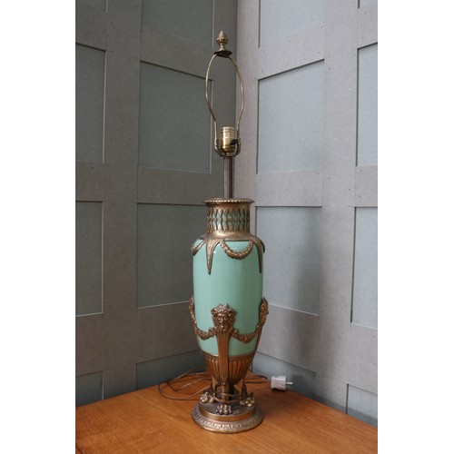 Neo-Classical jade opaline glass vase converted table lamp, attributed to WMF; in slender form, mounted in gilded brass; with gallery work upper, gadrooned lower, decorated with laurel garlands & satyr heads; supported by 4 lion's paws on a circular chased base, approx. H87cm
Bradleys shipping POA https://www.bradleys.ltd/quotation-request-form