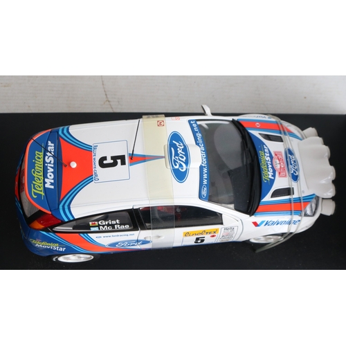 49 - Two 1/18th scale diecast WRC model cars from AutoArt to include 89992 1999 Subaru Impreza #5 Burns/R... 