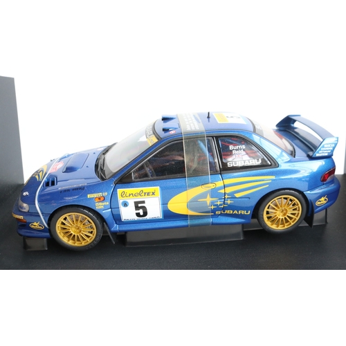 49 - Two 1/18th scale diecast WRC model cars from AutoArt to include 89992 1999 Subaru Impreza #5 Burns/R... 