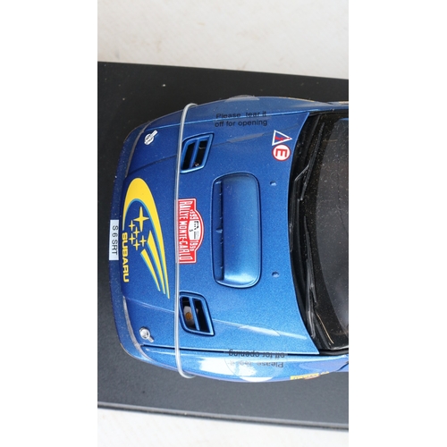49 - Two 1/18th scale diecast WRC model cars from AutoArt to include 89992 1999 Subaru Impreza #5 Burns/R... 