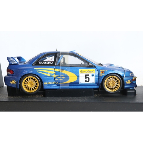 49 - Two 1/18th scale diecast WRC model cars from AutoArt to include 89992 1999 Subaru Impreza #5 Burns/R... 