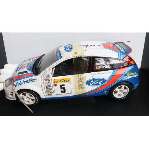 49 - Two 1/18th scale diecast WRC model cars from AutoArt to include 89992 1999 Subaru Impreza #5 Burns/R... 