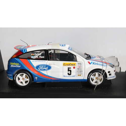 49 - Two 1/18th scale diecast WRC model cars from AutoArt to include 89992 1999 Subaru Impreza #5 Burns/R... 