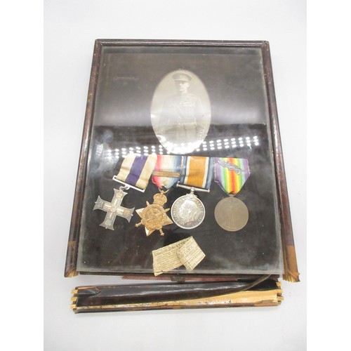 57 - Leather easel framed Military Cross WWI group of medals awarded to Major W. M. Biden, a display with... 