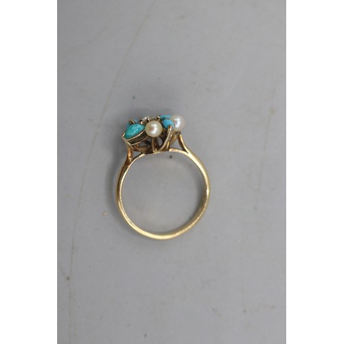 12 - Hallmarked 14ct yellow gold diamond, seed pearl and turquoise cocktail ring, comprised of one centra... 
