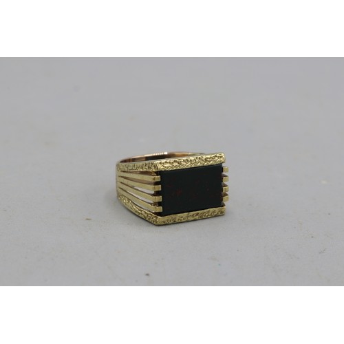 21 - Hallmarked 9ct yellow gold brutalist bloodstone signet ring, comprised of one rectangular bloodstone... 