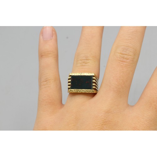 21 - Hallmarked 9ct yellow gold brutalist bloodstone signet ring, comprised of one rectangular bloodstone... 