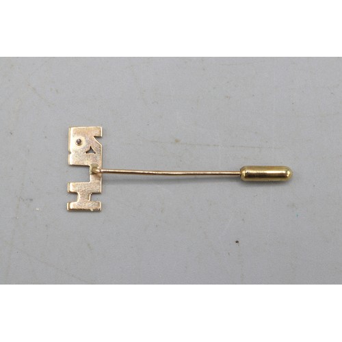 60 - Gold R.L.H form jewellery, comprised of a stamped 14ct yellow gold R.L.H. pin badge with white topaz... 