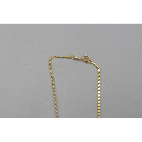 30 - Stamped 14ct yellow gold abstract bark-effect pendant on fixed bail, suspended on a stamped 14ct yel... 