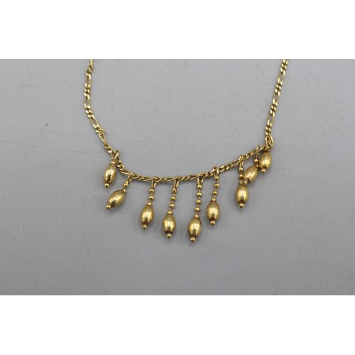 20 - Hallmarked 9ct yellow gold Figaro-link belcher chain, with graduated teardrop frill detail. 16