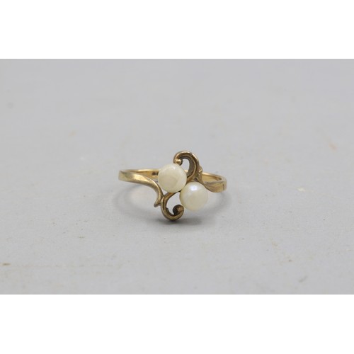 40 - Hallmarked 9ct yellow gold pearl toi et moi ring, comprised of two 4.8mm pearls in a scrollwork sett... 