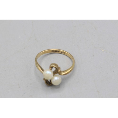 40 - Hallmarked 9ct yellow gold pearl toi et moi ring, comprised of two 4.8mm pearls in a scrollwork sett... 
