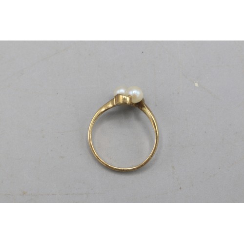 40 - Hallmarked 9ct yellow gold pearl toi et moi ring, comprised of two 4.8mm pearls in a scrollwork sett... 