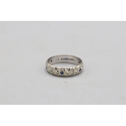50 - Hallmarked 9ct white gold diamond cut blue and white stone band ring, comprised of alternating round... 