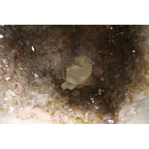  *RE-PHOTO* Amethyst geode, a free-standing cut-through specimen displaying a hollow interior cavity ... 