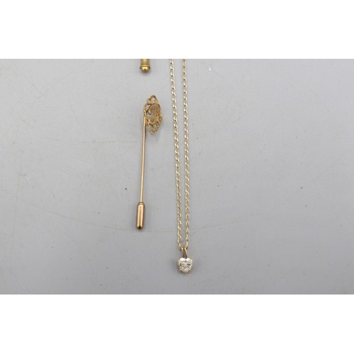 36 - Mixed lot of 9ct yellow gold comprised of a CZ heart pendant on stamped 9ct yellow gold chain, a 9ct... 