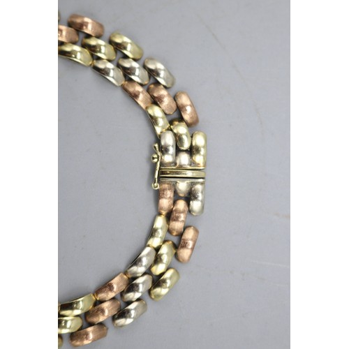 7 - Stamped 9ct gold tricolour brick link bracelet, comprised of alternating rows of brushed rose gold a... 