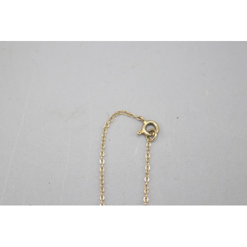 42 - 9ct yellow gold pendants, comprised of a hallmarked 9ct yellow gold heart locket with small pavé sta... 